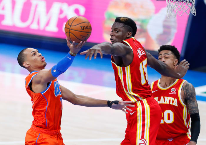 Bazley gets to the rim against Atlanta's Clint Capela as forward John Collins watches on.